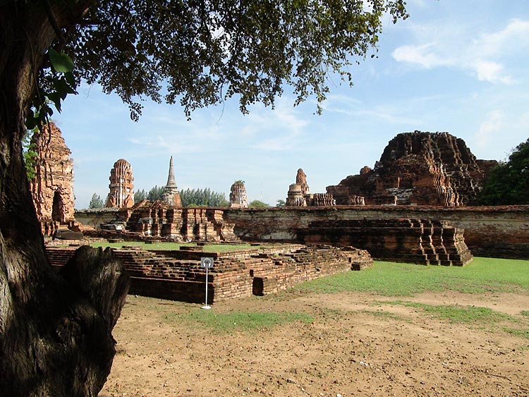 At Wat Mahathat. Notice the remains of the main prang (collapsed in 1911) to the right